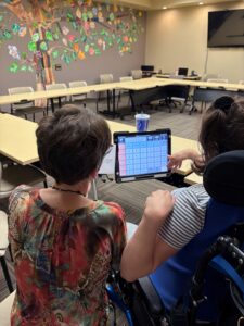 Ann and Katrina work on the script for the WACOSA ThriftWorks radio ad.